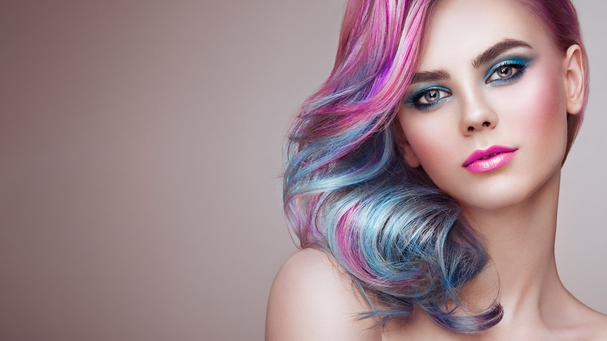 woman with pink hair and blue eyeshadow